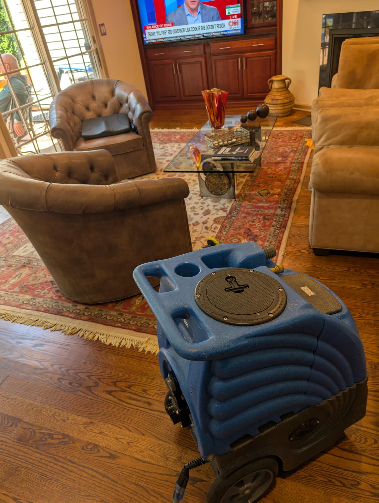 Upholstered leather chairs on a patterned area rug in a formal setting — comparable to a funeral-home viewing room or family lounge